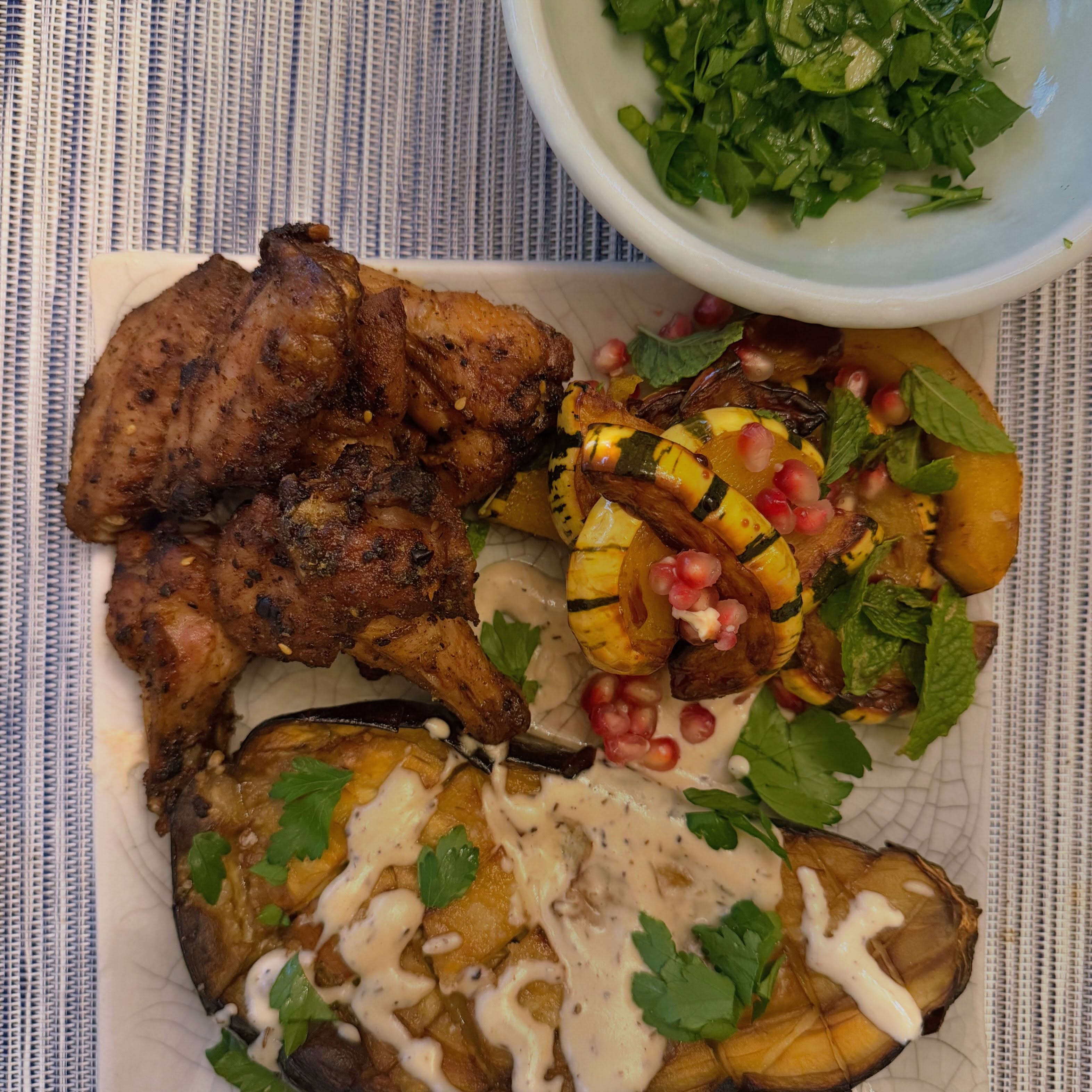Middle Eastern Chicken Wings with Pomegranate Delicata, Roasted Eggplant, Tahina and Date-Tahini Halva
